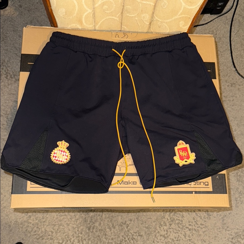 100 percent Authentic Rhude Soccer Shorts with Embroidered Crest Patches.